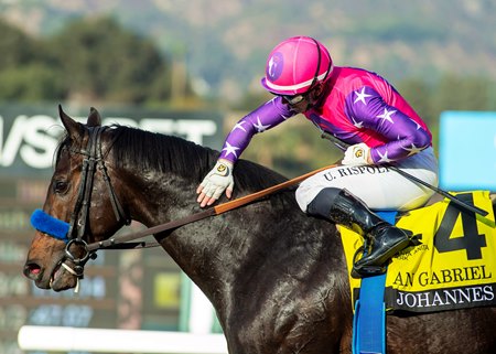 Johannes gets a pat on the neck from Umberto Rispoli after winning the San Gabriel Stakes at Santa Anita Park