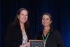 Kelley Stobie, executive director of Caribbean Thoroughbred Aftercare (CTA), accepts the American Association of Equine Practitioners (AAEP) 2024 A. Gary Lavin Equine Welfare Award