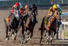12/14/2024 - Blue Fire with jockey Jose Ortiz turns for hime in front and goes on towin the 34th running of the $100,000 Louisiana Champions Day Lassie at Fair Grounds.&#160; Hodges Photography / Jan Brubaker