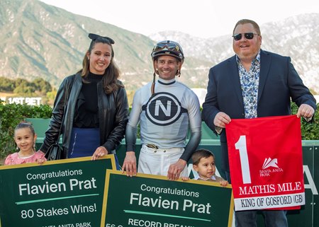 Flavien Prat celebrates his record-setting 56th graded stakes victory after King of Gosford won the Mathis Mile Stakes at Santa Anita Park