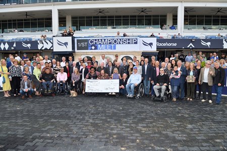 A Jockeys and Jeans presentation in the winner's circle at Gulfstream Park