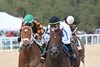 Naughty Rascal (outside) is awarded the win in the 2025 Pasco Stakes at Tampa Bay Downs after the disqualification of Owen Almighty, who finished first      