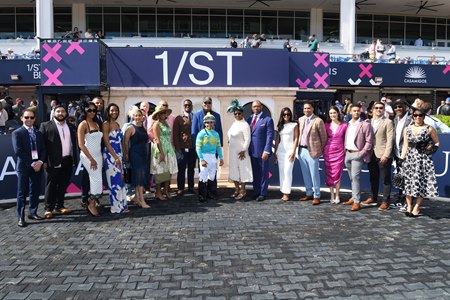 Ed Brown Society representatives and others in the winner's circle at Gulfstream Park