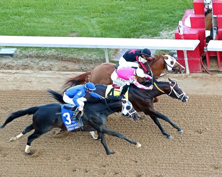 Alexander Helios (middle) wins the Razorback Handicap at Oaklawn Park