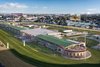 An artist&#39;s rendering of an aerial view of planned new permanent infield seating at Churchill Downs that will be known as the Conservatory Project