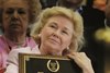 Patrice Wolfson holds plaque for Flawlessly during speeches at the Hall of Fame inductions August 9, 2004.