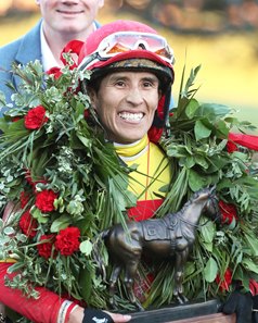 Juan Vargas celebrates Coal Battle's victory in the Rebel Stakes at Oaklawn Park