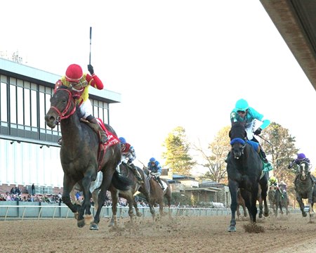 Jockey Juan Vargas salutes the crowd as Coal Battle wins the Rebel Stakes at Oaklawn Park