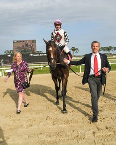 Christine and Phil Hatfield lead Saffron Moon into the winner's circle after her victory in the Hillsborough Stakes at Tampa Bay Downs