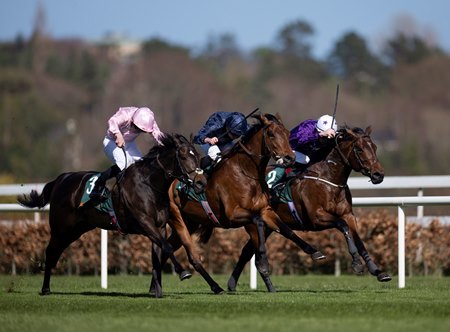Henri Matisse (between horses) surges late to win the Ballylinch Stud Red Rocks Stakes at Leopardstown Racecourse