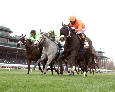 Shisospicy (orange cap) narrowly defeats Dreamaway (gray horse) in the Limestone Stakes at Keeneland