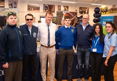 Trainer Aidan O’Brien (second from left), principal Billy Walsh (white shirt), and Coolmore’s M.V. Magnier (third from right) with students from Fethard’s Patrician Presentation Secondary School