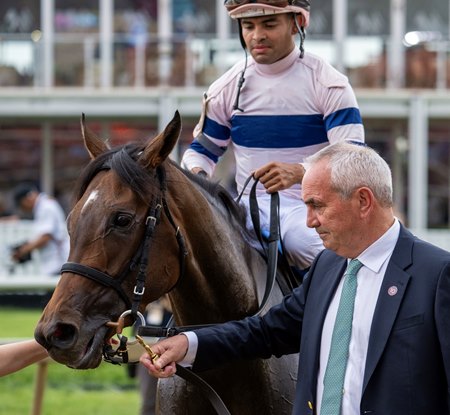 Gabriel "Spider" Duignan leads Echo Sound to the winner's circle after the Miss Preakness Stakes at Pimlico Race Course