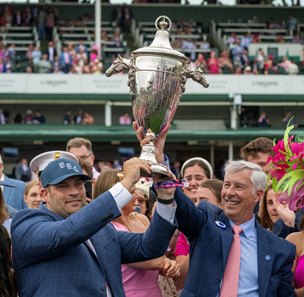 (From left): Trainer Brad Cox and Godolphin USA director of bloodstock Michael Banahan celebrate a victory from Good Cheer in the Kentucky Oaks at Churchill Downs
