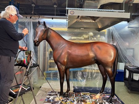 Artist Mike Prather paints a horse replica depicting Kentucky Derby winner Sovereignty