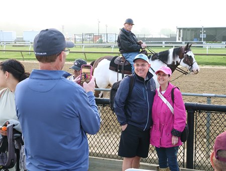 Fans take a photo with D. Wayne Lukas the morning of May 16 at Pimlico