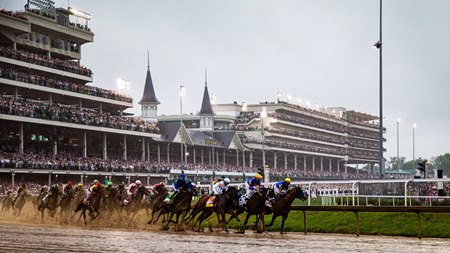 The field races through the first turn in the 2025 Kentucky Derby at Churchill Downs