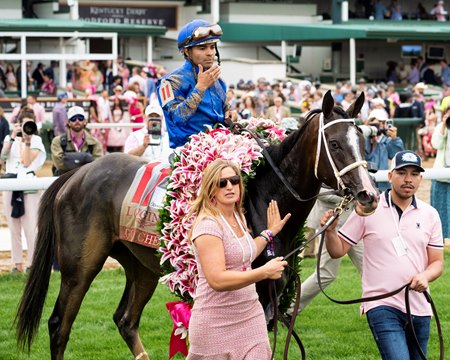 Good Cheer is led to the winner's circle following the Kentucky Oaks at Churchill Downs