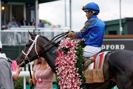 Good Cheer in the winner's circle after her victory in the Kentucky Oaks at Churchill Downs
