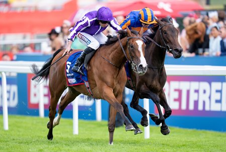 Minnie Hauk (outside) edges stablemate Whirl to win the Epsom Oaks at Epsom Downs Racecourse