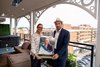 Trainer Jena Antonucci and NTL co-founder Randall Lane display a large version of her NTL trading card