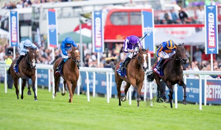 Whirl (inside) finishes second to Minnie Hauk, with Wemightakedlongway (far left) fourth in the Oaks at Epsom Racecourse