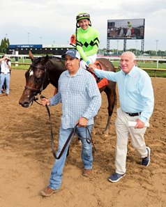 Richard Klein (right) joins Brilliant Berti after winning the Wise Dan Stakes at Churchill Downs