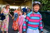 Julien Leparoux after riding in race 5, on number 9 Vive Veuve who finished second, walks toward the paddock and jockeys room followed by his family at Keeneland on April 18, 2025, in Lexington, Ky. 