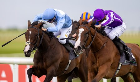 Minnie Hauk (right) wins the Irish Oaks at the Curragh