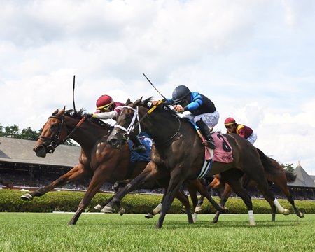 Deep Satin (outside) wins a division of the De La Rose Stakes at Saratoga Race Course