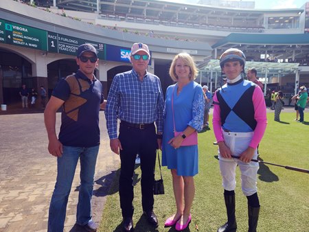 Steve and Denise Smith, center, at Churchill Downs