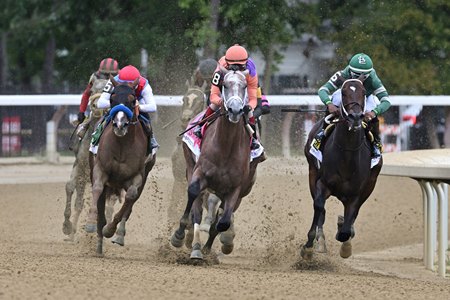 Buetane (blue shadow roll) chases eventual winner Ted Noffey into the stretch of the 2025 Hopeful Stakes at Saratoga Race Course