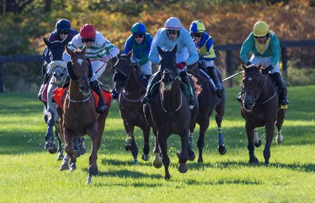 Zanahiyr (left, red cap) on his way to victory in the 2025 American Grand National Stakes