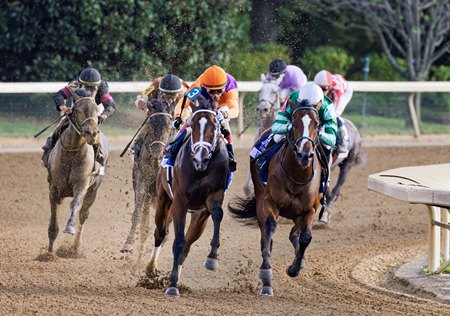 Tommy Jo (orange cap) and Percy's Bar battle into the stretch of the Alcibiades Stakes at Keeneland