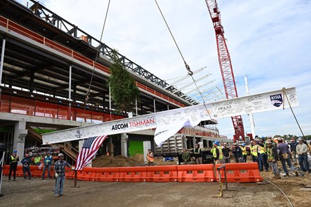 The final beam of the new grandstand is lifted into place at Belmont Park