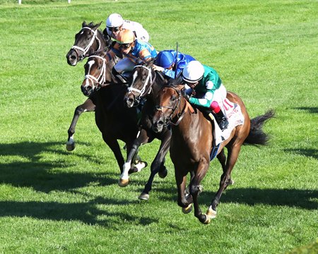 Imaginationthelady (inside) defeats fellow Not This Time fillies Infinite Sky (blue silks) and Time to Dream (orange cap) in the Jessamine Stakes at Keeneland