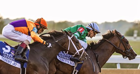 Percy's Bar, under Luan Machado, leads in the Alcibiades Stakes before her eventual disqualification at Keeneland