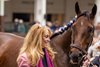 Anna's Co-Owner and breeder, Judy Hicks, and a groom for Kenny McPeek walk Thorpedo Anna in the paddock at Churchill Downs.