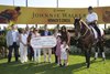 Michael Copeland, CEO of Woodbine, makes a presentation to Vicki Pappas, chairperson and founding member of LongRun, local trainer and volunteer Liz Elder, and Thoroughbred Aftercare Alliance’s Stacie Clark Rogers and Emily Dresden and Emily’s daughters Aria and Lainey. (Michael Burns Photo)