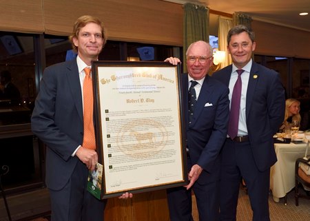 Robert Clay, middle, accepts the scroll as the 2025 Thoroughbred Club of America's Honor Guest Nov. 15 at Keeneland. He is joined by scroll presenter Jamie Nicholson, left, and TCA president W. Chapman Hopkins