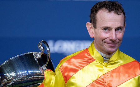 Ryan Moore accepts his third Longines International Jockeys' Championship at Happy Valley Racecourse in Hong Kong