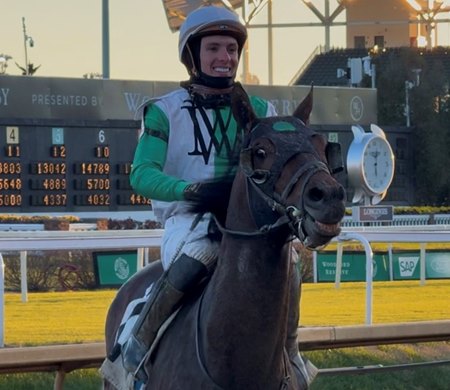 Dylan Machado returns to the winner's circle after winning aboard Good Money at Churchill Downs