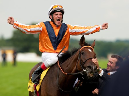 Andrasch Starke celebrates aboard Danedream after their victory in the 2012 King George VI and Queen Elizabeth Stakes at Ascot Racecourse