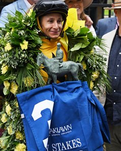 Francisco Arrieta celebrates winning the Fantasy Stakes aboard Counting Stars at Oaklawn Park