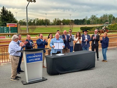 In a ceremonial signing at Hollywood Casino at Charles Town Races, West Virginia Gov. Patrick Morrisey approves legislation that will provide added funding for the industry in the state
