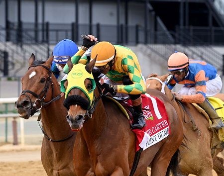 Point Dume (blinkers) holds off Book'em Danno to win the Carter Stakes at Aqueduct Racetrack