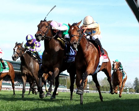 Expensive Queen (inside) and Segesta finish in a dead heat to win the Jenny Wiley Stakes at Keeneland