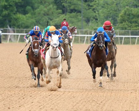 White Abarrio defeats Sovereignty (right) and Journalism (left) to win the Oaklawn Handicap at Oaklawn Park
