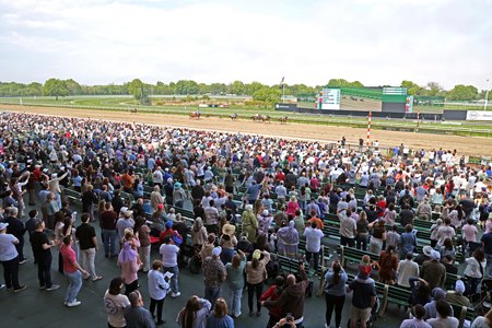 Fans watch a race on Mother's Day at Monmouth Park