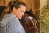 Kentucky Derby winning trainer, Cherie DeVaux, Golden Tempo, and Reggie the dog, who was found in the Keeneland infield and Cherie took her in.